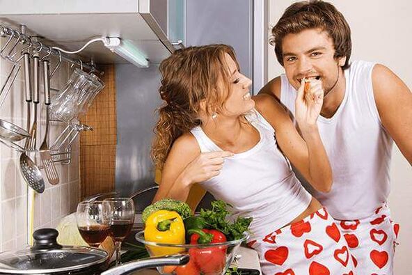 a woman feeds a man a product for potency